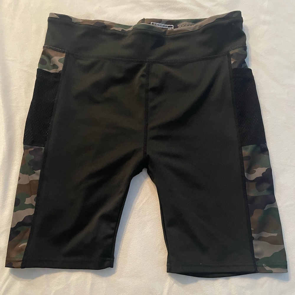 Camo and black bike shorts with mesh pockets